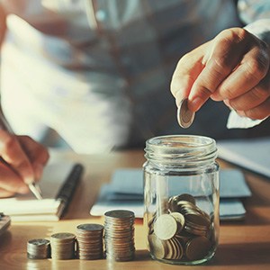 Money being put into a jar