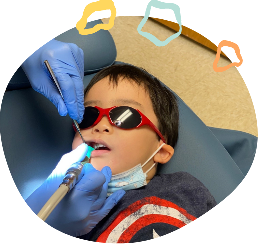 Young boy receiving dental treatment