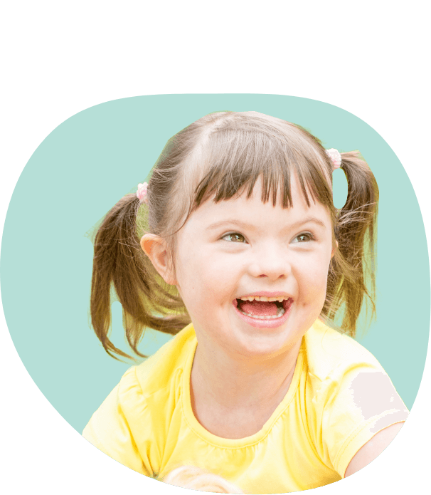 Young girl with pigtails smiling after visiting her pediatric special needs dentist in South Portland and Auburn