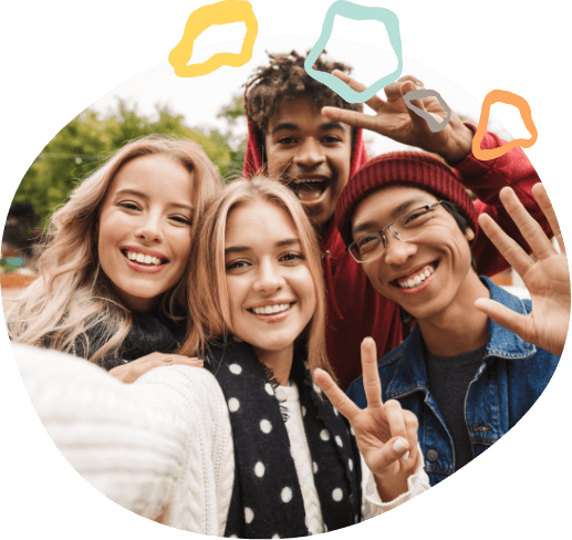 Group of teenagers taking selfie outdoors