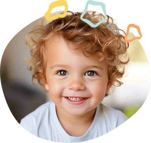 Smiling toddler with curly blond hair