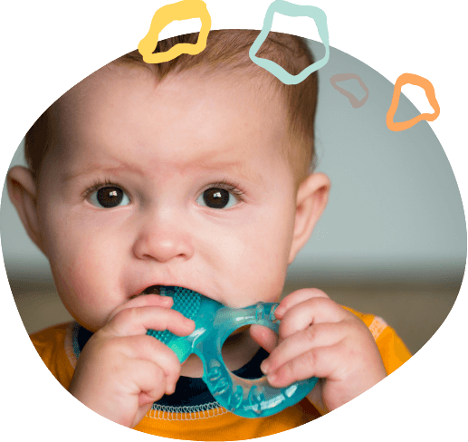 Toddler chewing on a blue teething ring