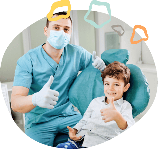 Pediatric dentist and young patient giving thumbs up together